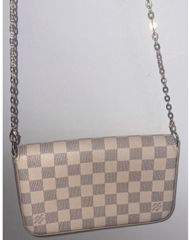 A compact Louis Vuitton beige checkered crossbody bag with a flap clos